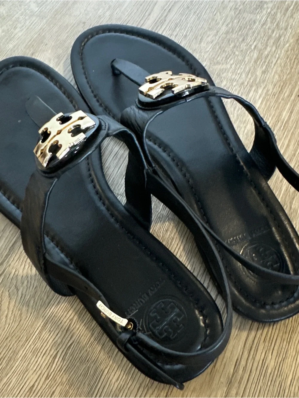 Tory Burch Black Leather T-Strap Sandals with Gold Logo Medallion